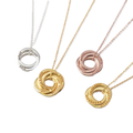 Four gold necklaces with interlocking rings on a white background