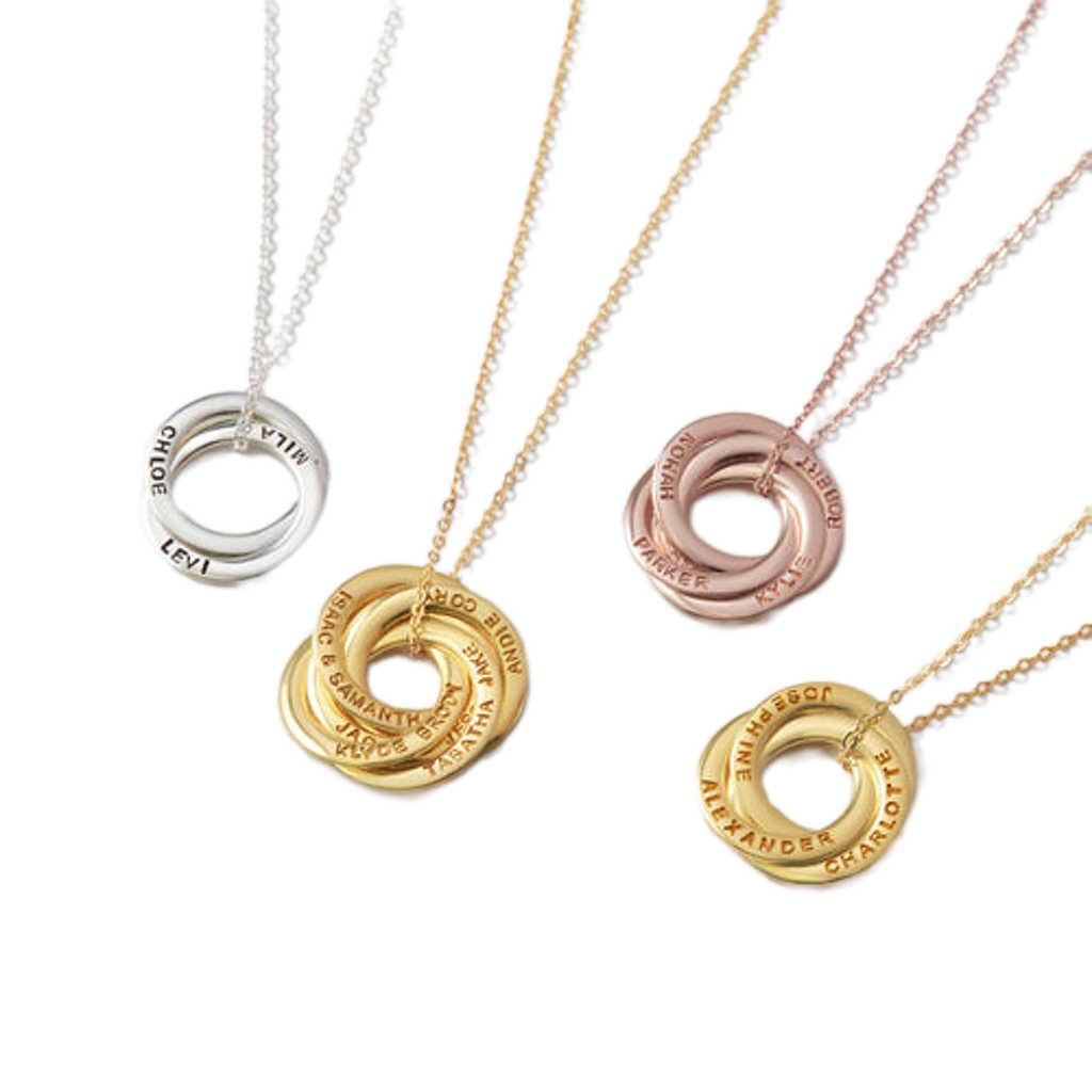 Four gold necklaces with interlocking rings on a white background