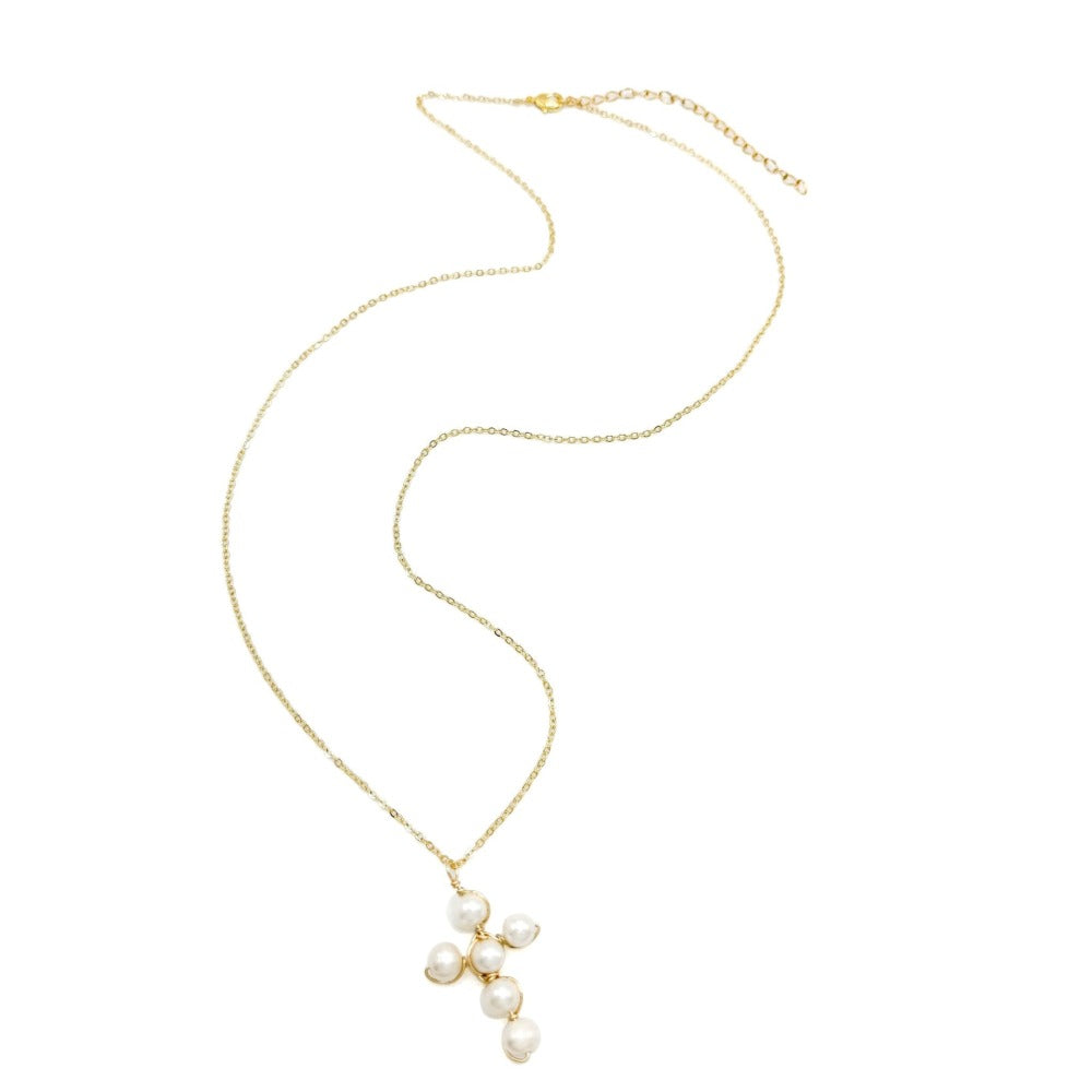 Gold necklace with pearl pendants on a white background
