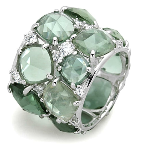 Ring with green gemstones and silver accents on a white background